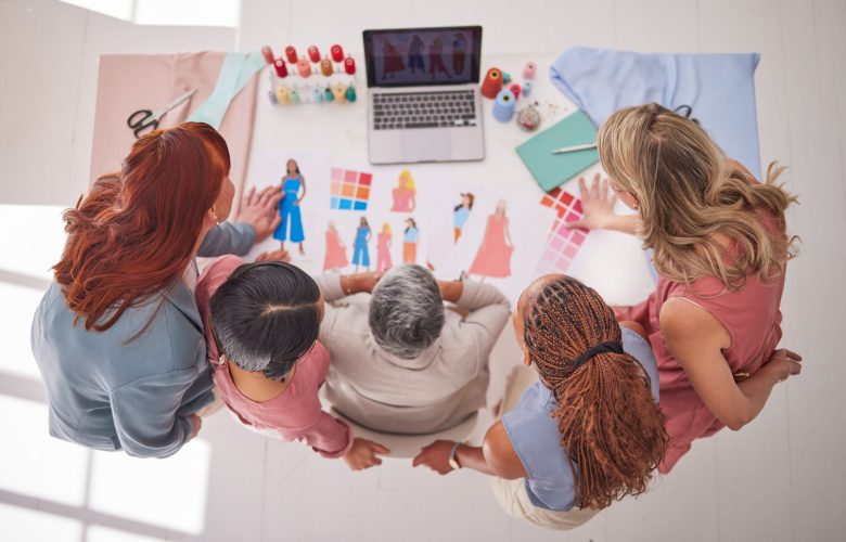 Creative business people, fashion and design above in meeting for planning, collaboration or decisi.